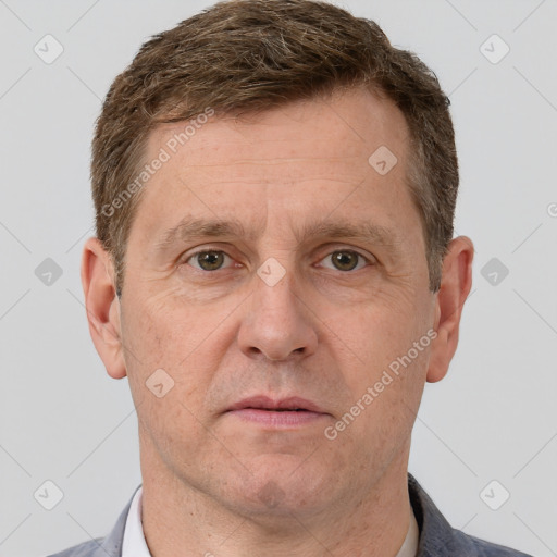 Joyful white adult male with short  brown hair and grey eyes