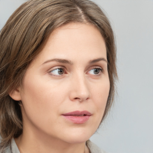 Neutral white young-adult female with medium  brown hair and grey eyes