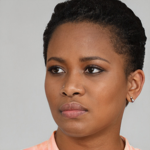Neutral black young-adult female with short  black hair and brown eyes