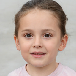 Joyful white child female with short  brown hair and brown eyes
