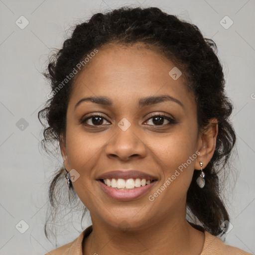 Joyful black young-adult female with medium  brown hair and brown eyes