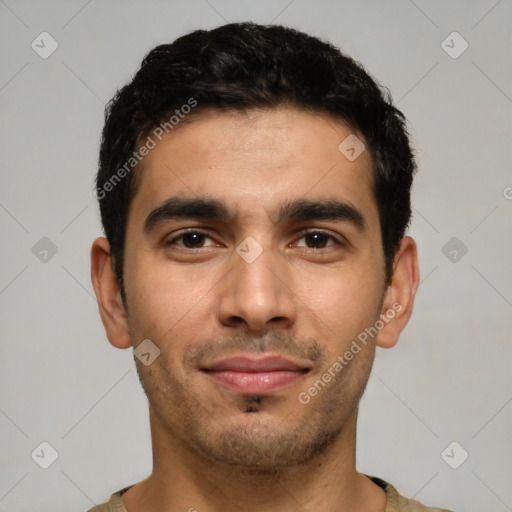 Joyful latino young-adult male with short  black hair and brown eyes