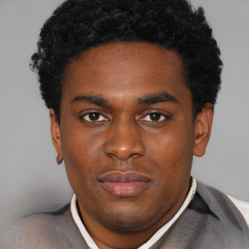 Neutral black young-adult male with short  black hair and brown eyes