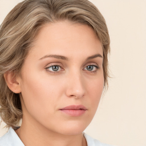 Neutral white young-adult female with medium  brown hair and green eyes