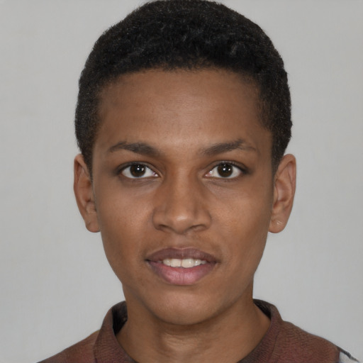 Joyful black young-adult male with short  brown hair and brown eyes
