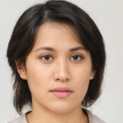 Neutral asian young-adult female with medium  brown hair and brown eyes