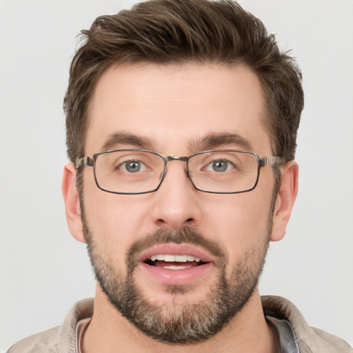 Joyful white adult male with short  brown hair and brown eyes