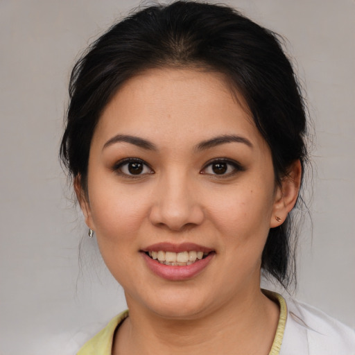 Joyful asian young-adult female with medium  brown hair and brown eyes