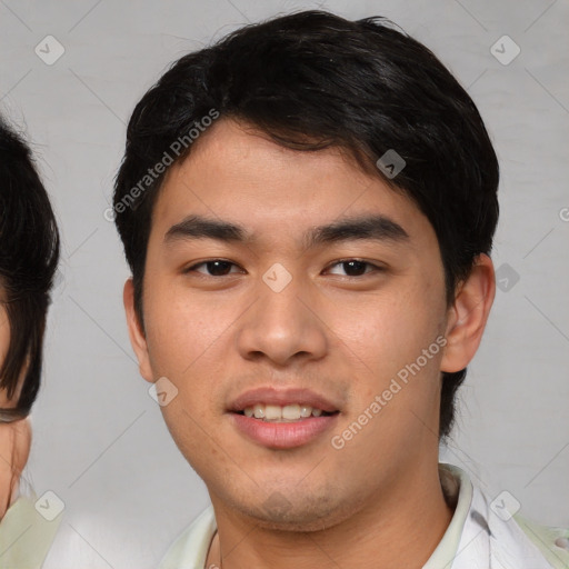 Joyful asian young-adult male with short  brown hair and brown eyes