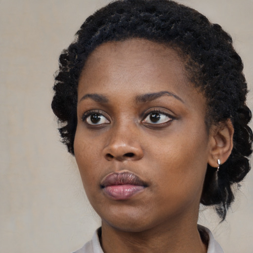 Neutral black young-adult female with medium  black hair and brown eyes