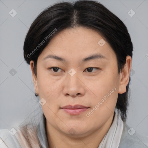 Joyful asian adult female with medium  brown hair and brown eyes