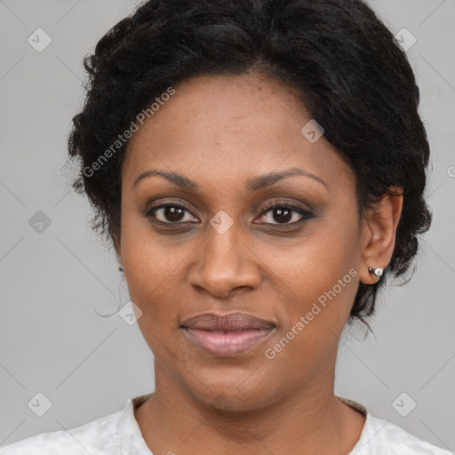 Joyful black adult female with short  brown hair and brown eyes