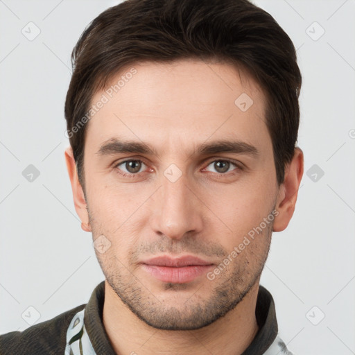 Neutral white young-adult male with short  brown hair and brown eyes