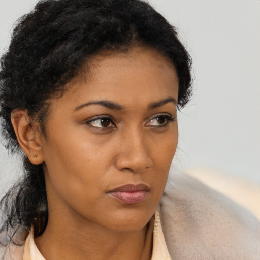 Neutral black young-adult female with short  brown hair and brown eyes