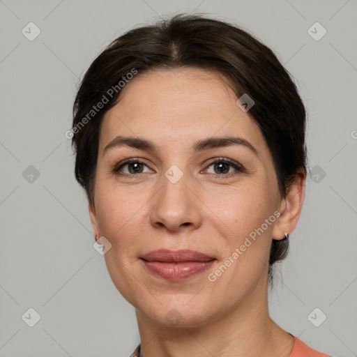 Joyful white adult female with short  brown hair and brown eyes