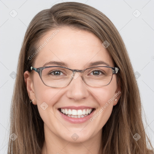 Joyful white adult female with long  brown hair and grey eyes