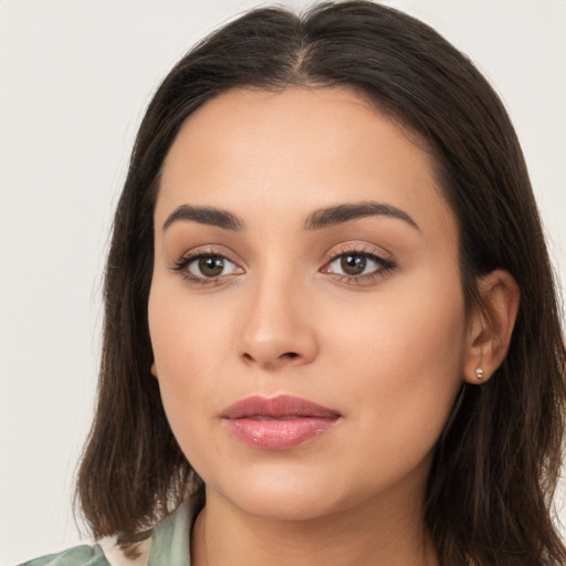 Neutral white young-adult female with long  brown hair and brown eyes