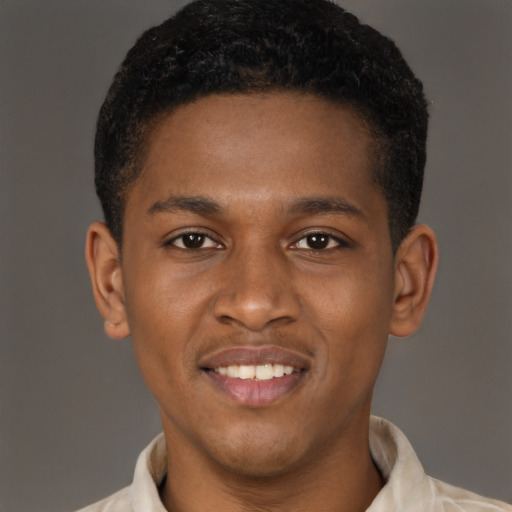 Joyful latino young-adult male with short  brown hair and brown eyes