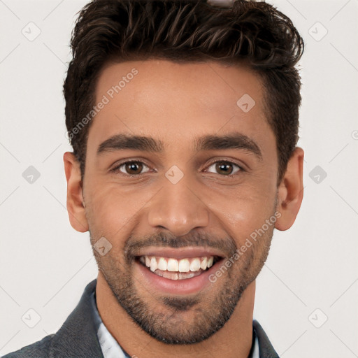 Joyful white young-adult male with short  black hair and brown eyes