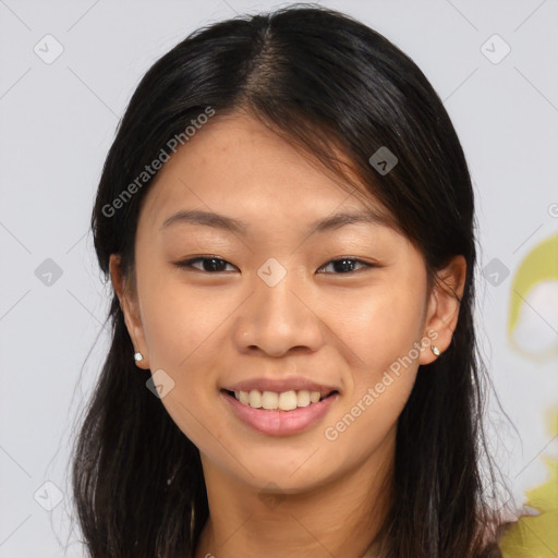 Joyful asian young-adult female with long  brown hair and brown eyes