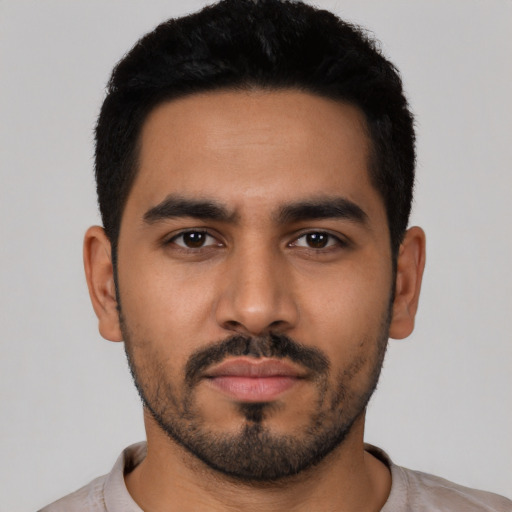 Neutral latino young-adult male with short  black hair and brown eyes