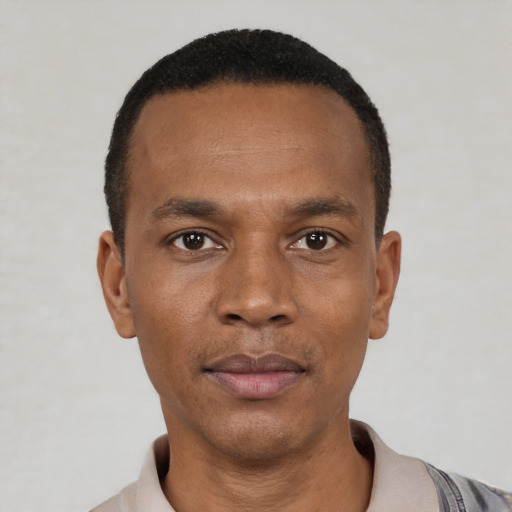 Neutral latino adult male with short  black hair and brown eyes