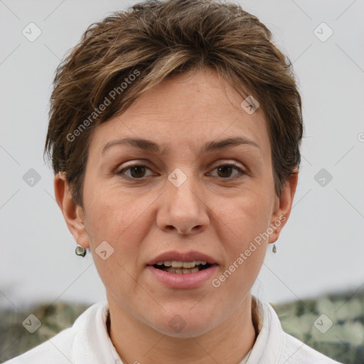 Joyful white adult female with short  brown hair and brown eyes