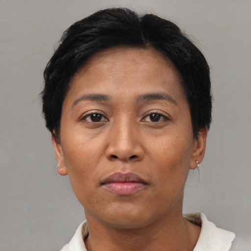 Neutral asian adult female with short  brown hair and brown eyes
