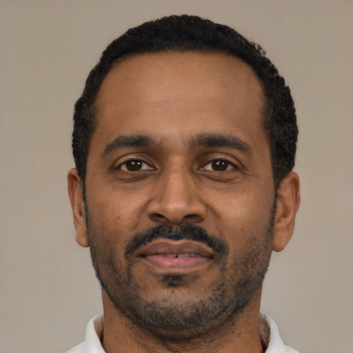 Neutral latino adult male with short  black hair and brown eyes