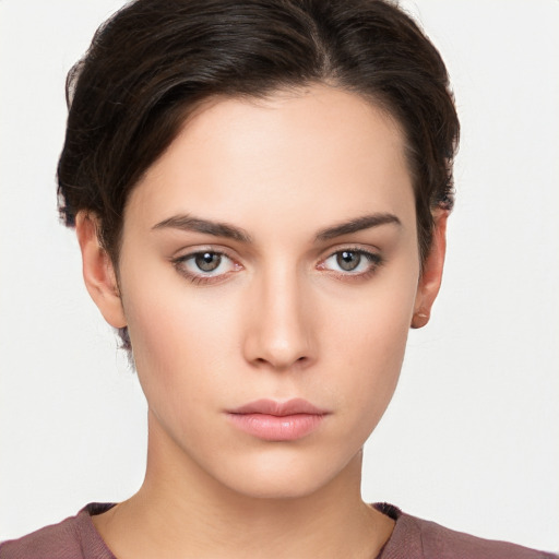 Neutral white young-adult female with short  brown hair and brown eyes