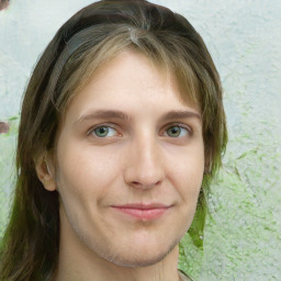 Joyful white young-adult female with long  brown hair and green eyes