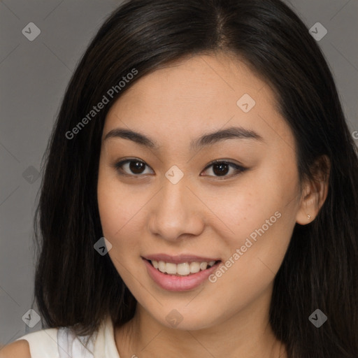 Joyful asian young-adult female with long  brown hair and brown eyes