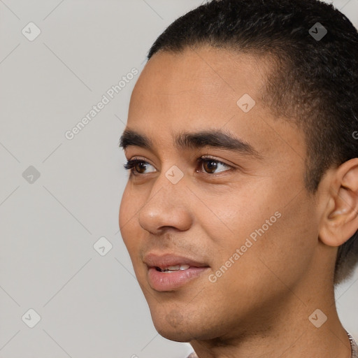 Joyful white young-adult male with short  black hair and brown eyes