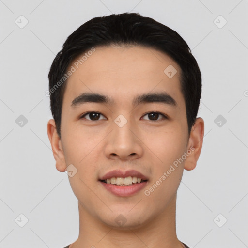 Joyful asian young-adult male with short  black hair and brown eyes