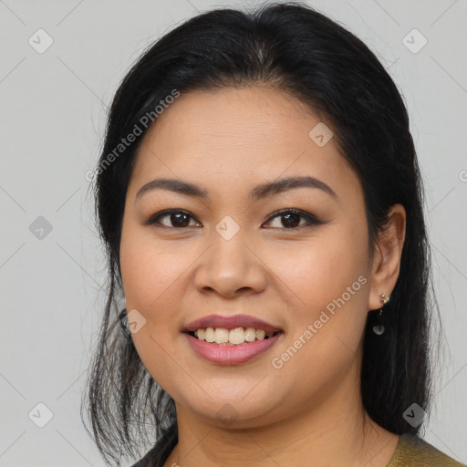 Joyful asian young-adult female with long  brown hair and brown eyes