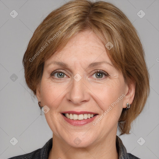 Joyful white adult female with medium  brown hair and grey eyes