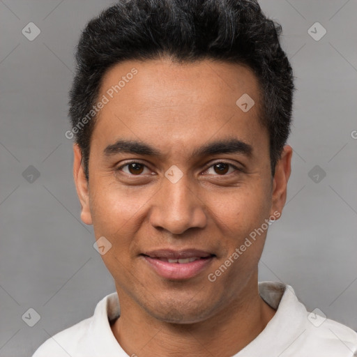 Joyful white young-adult male with short  black hair and brown eyes