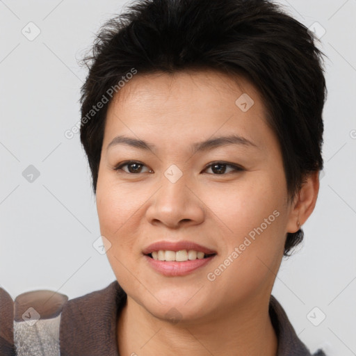 Joyful asian young-adult female with short  brown hair and brown eyes