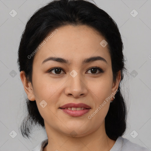 Joyful latino young-adult female with medium  brown hair and brown eyes