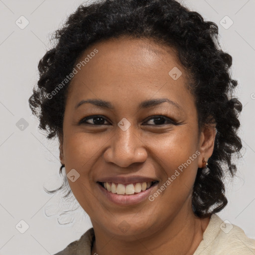 Joyful black young-adult female with long  brown hair and brown eyes