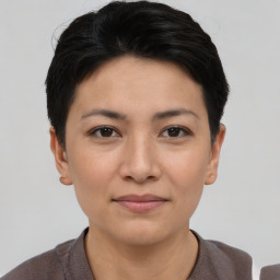 Joyful asian young-adult female with short  black hair and brown eyes