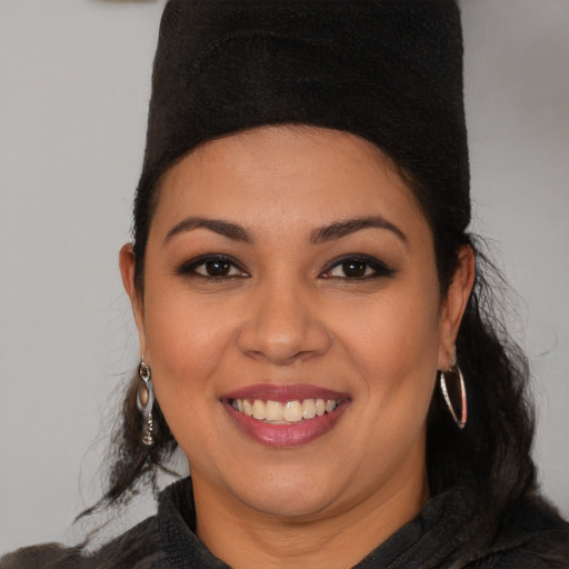 Joyful latino young-adult female with medium  brown hair and brown eyes