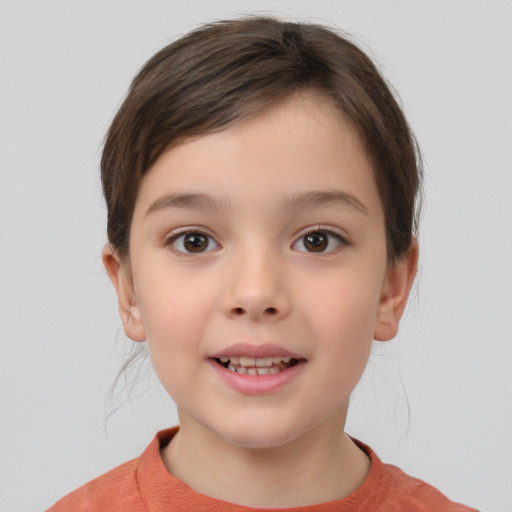 Joyful white child female with short  brown hair and brown eyes