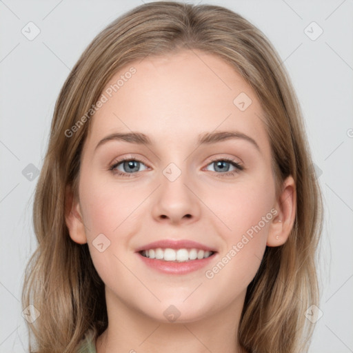 Joyful white young-adult female with long  brown hair and grey eyes