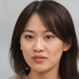 Neutral asian young-adult female with medium  brown hair and brown eyes