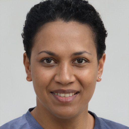 Joyful white young-adult female with short  black hair and brown eyes