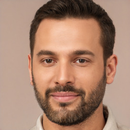 Joyful white young-adult male with short  brown hair and brown eyes