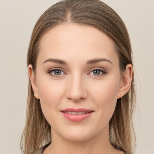 Joyful white young-adult female with long  brown hair and grey eyes