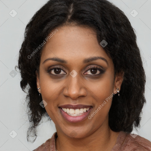 Joyful black young-adult female with long  brown hair and brown eyes