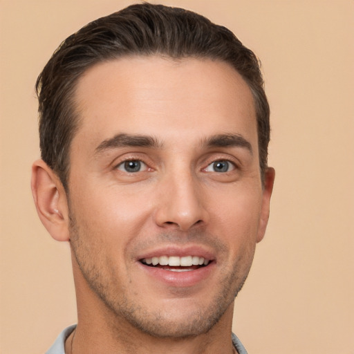 Joyful white young-adult male with short  brown hair and brown eyes